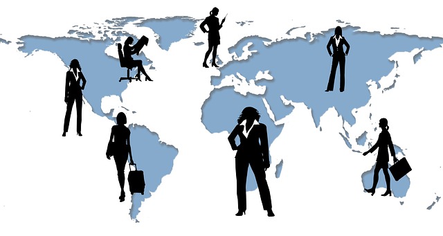A blue silhouette of a world map with 7 women in black silhouette standing across the map